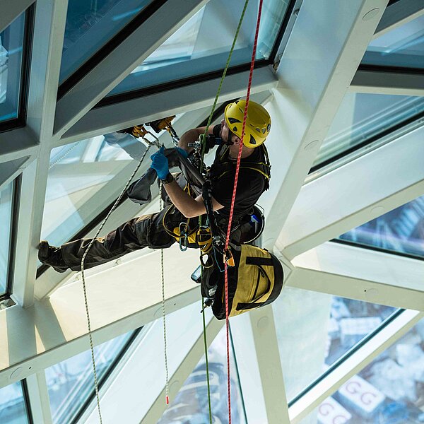 Industrial climber faces overhead