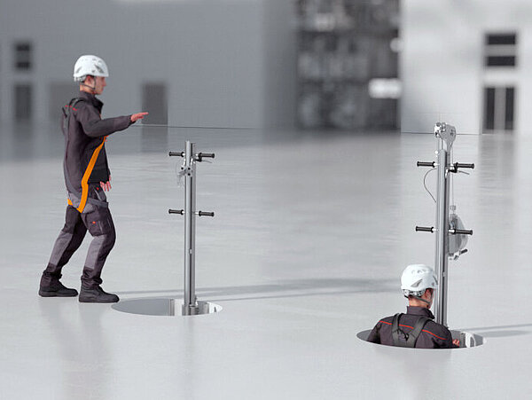 Un travailleur du bâtiment se déplace dans un regard conformément à l'ordonnance sur la protection des travailleurs du bâtiment.